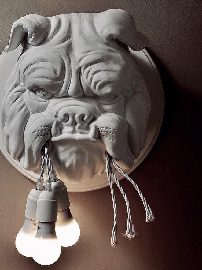 White bulldog face with illuminated bulbs below its mouth