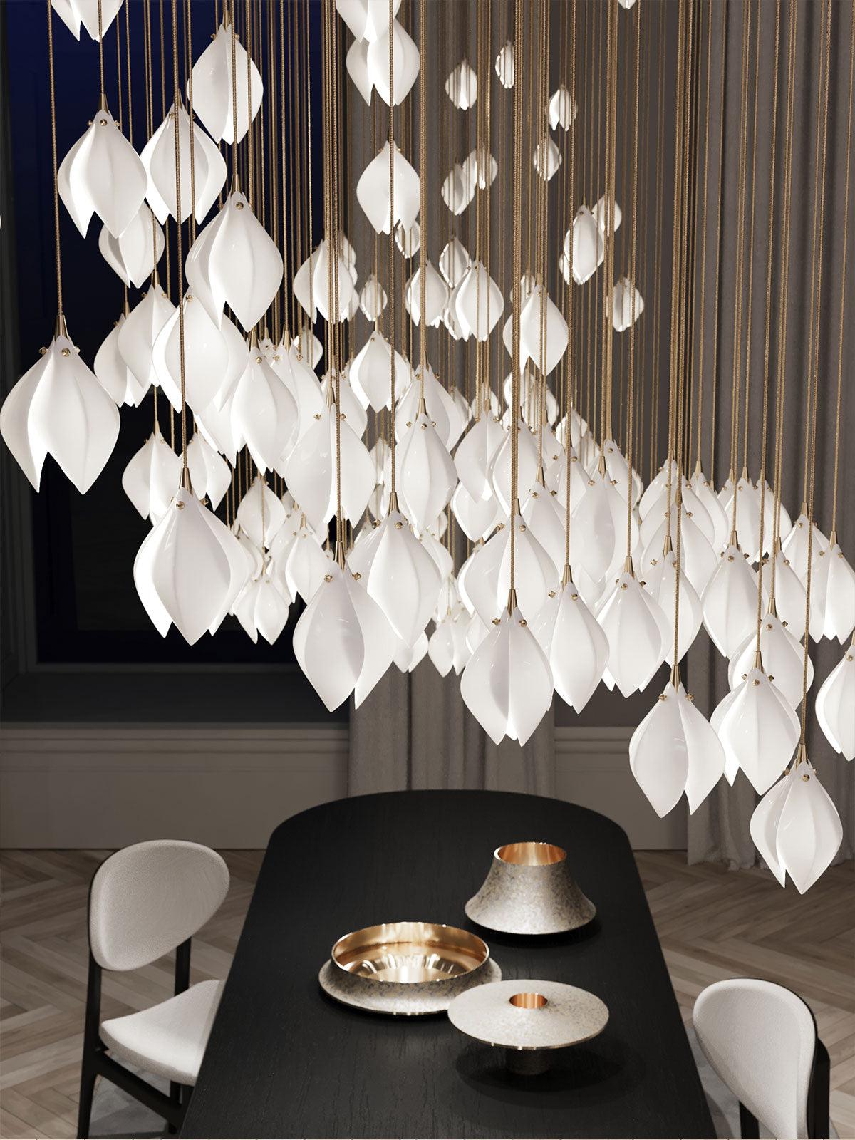 Wide bud arrangement above a dark dining table