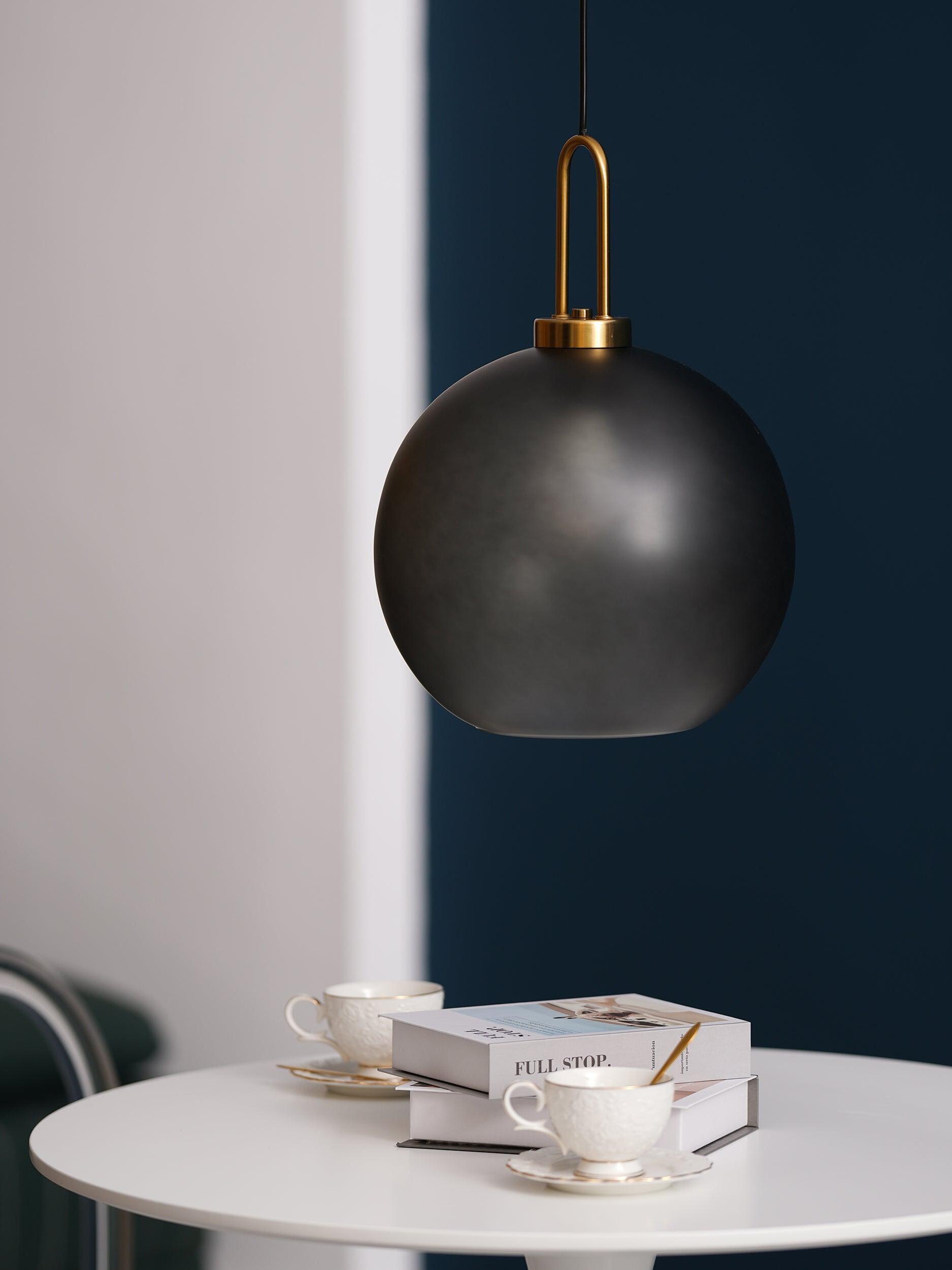 Smoky globe pendant in a small seating space