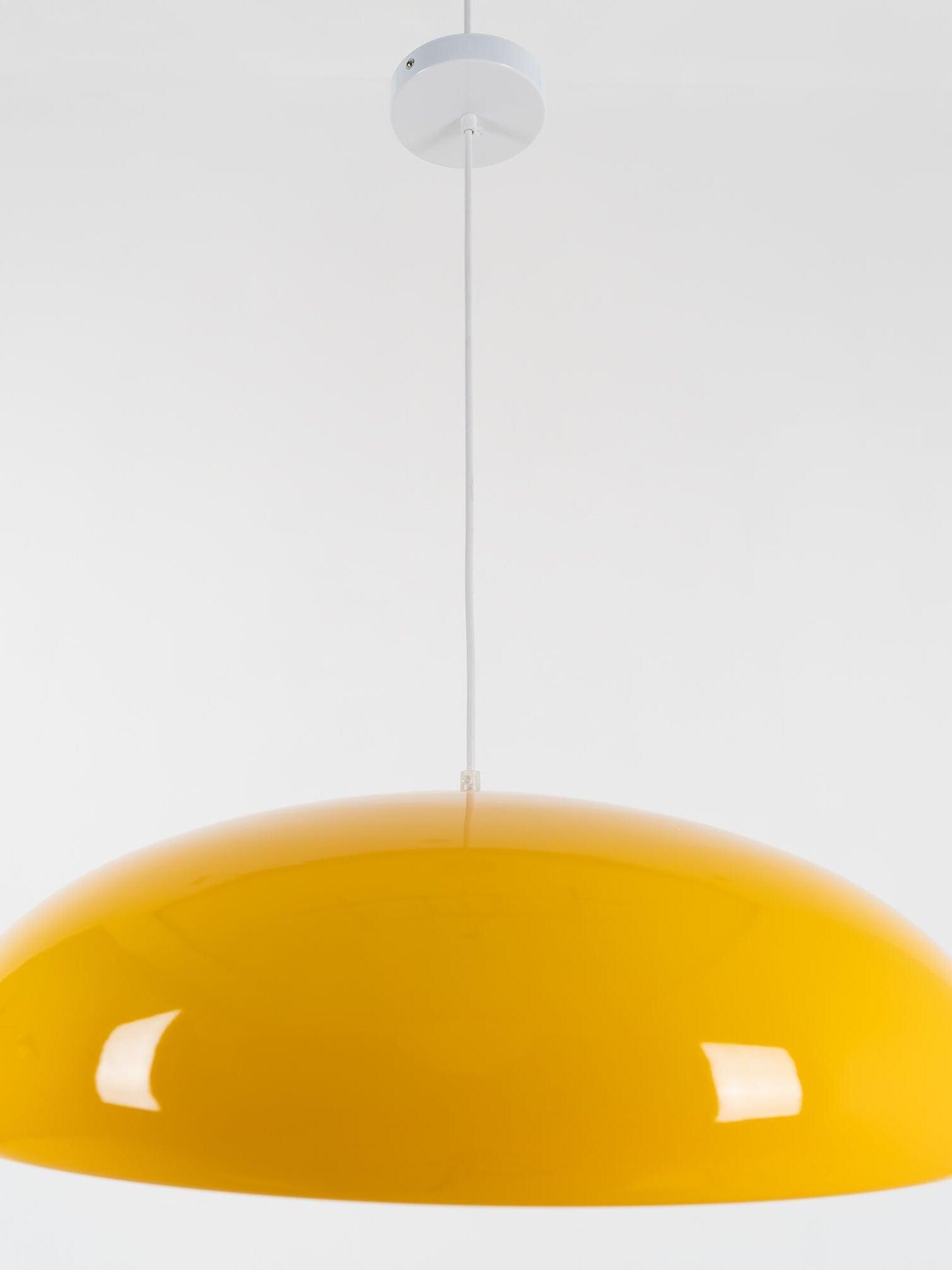 Close view of a yellow dome shade suspended beneath a white ceiling canopy