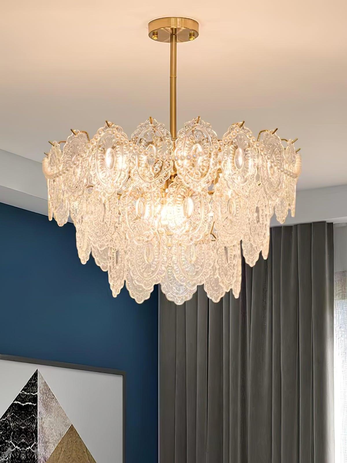 Layered chandelier in room with dark blue wall