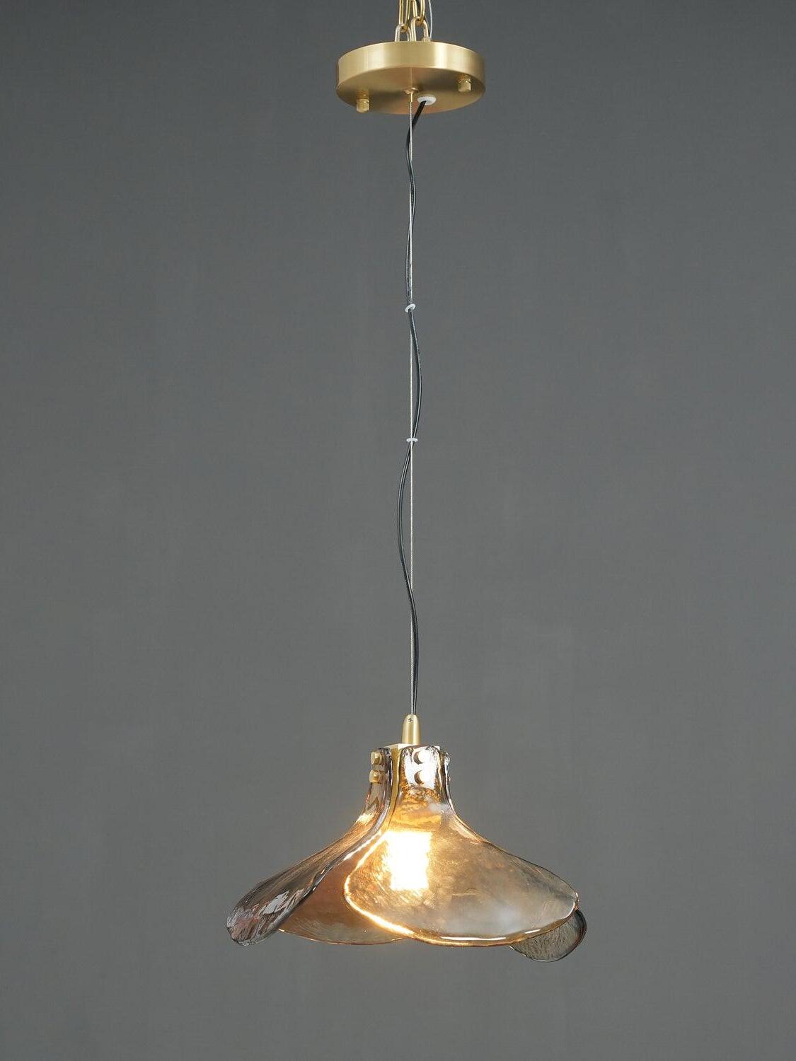 Lit LS185 brown glass pendant on dark background
