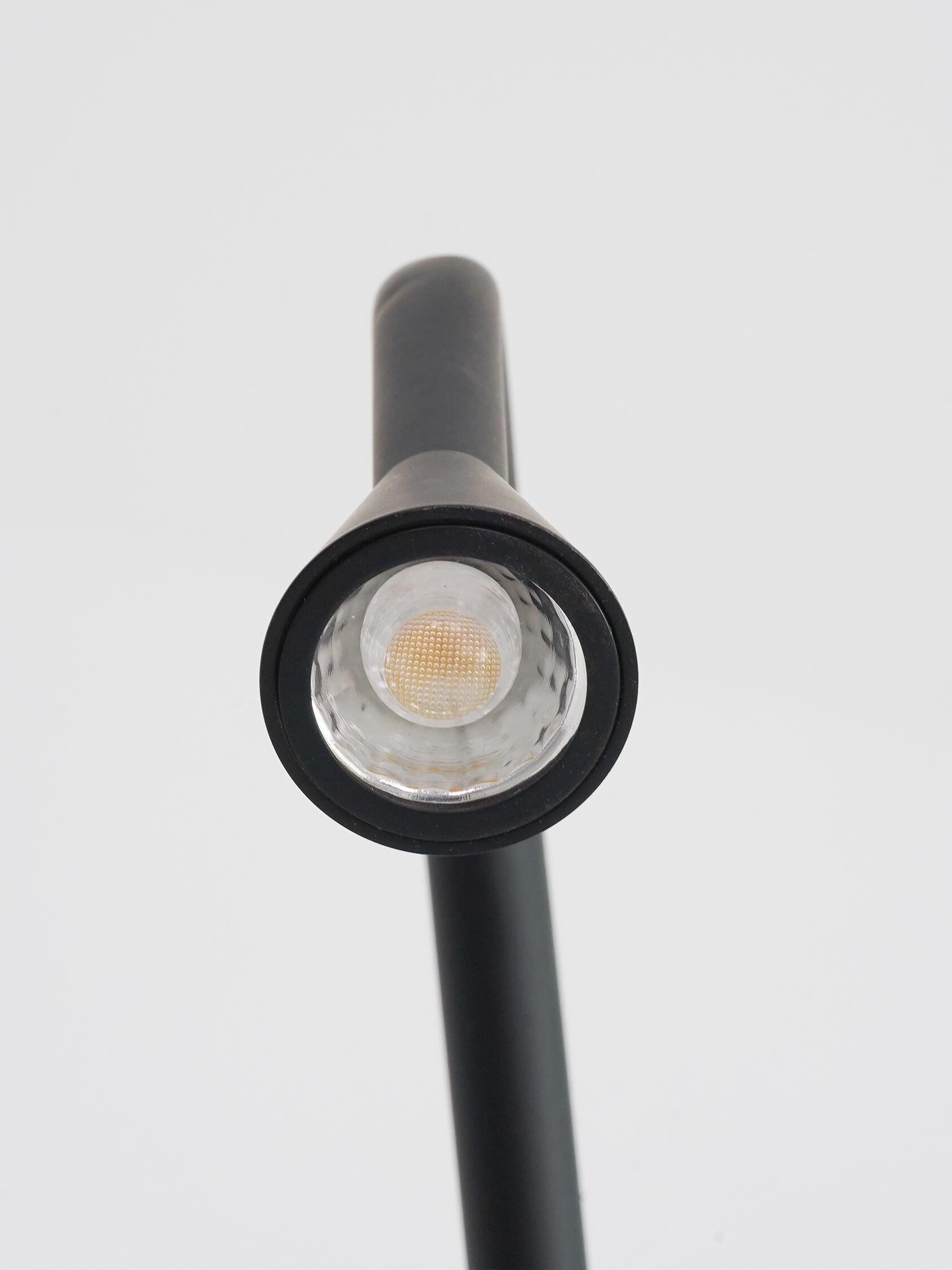 Close view of round light surface inside Black tapered head