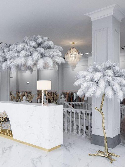 Chain chandelier near a patterned wall and console
