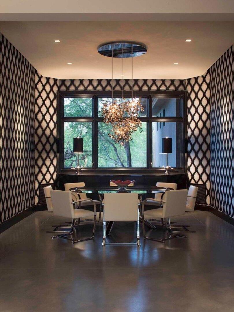 Lit metal-disc cluster below a dark round ceiling canopy