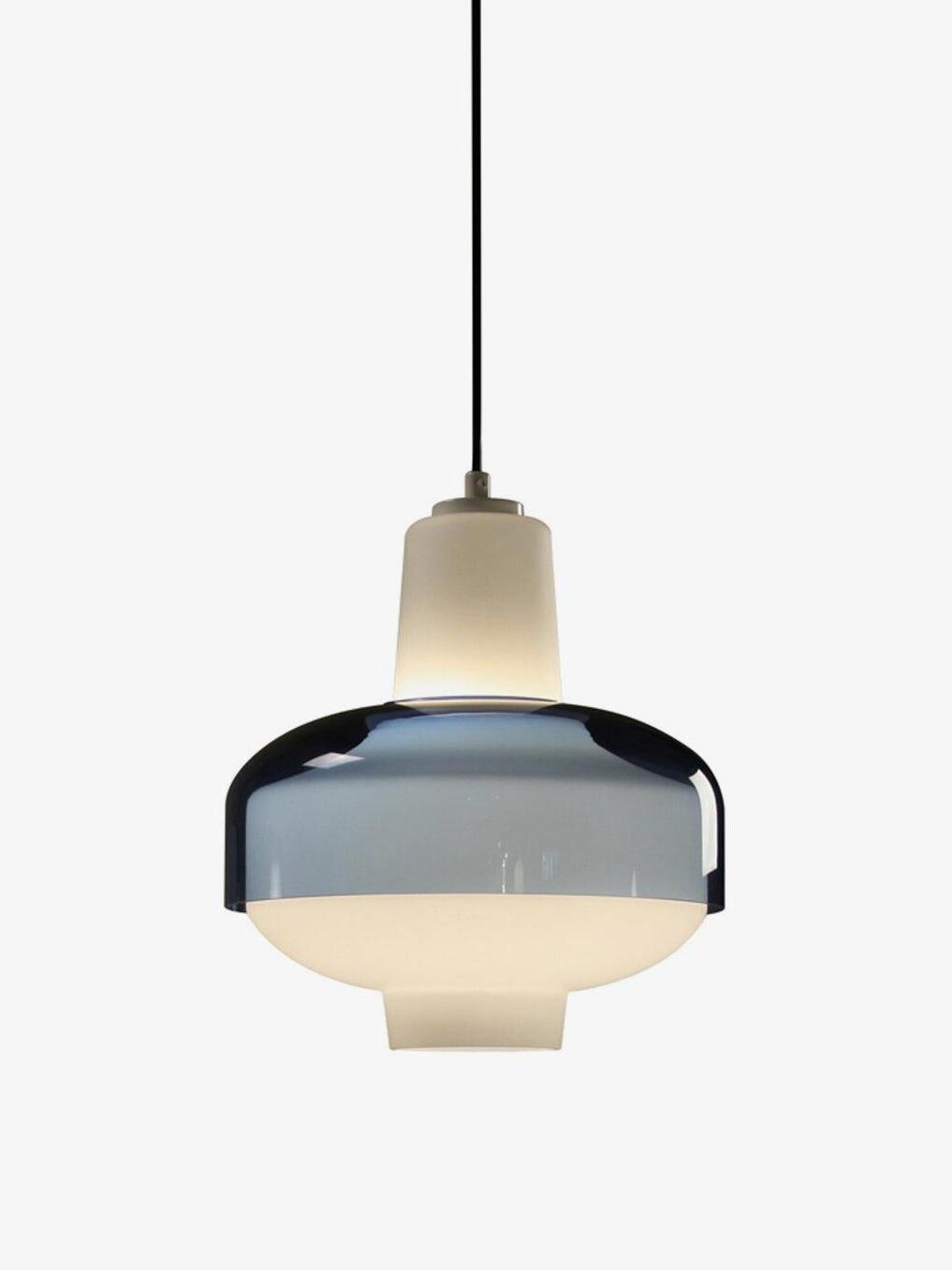 Trendy pendant with an illuminated white glass body, blue dome band and black cord.