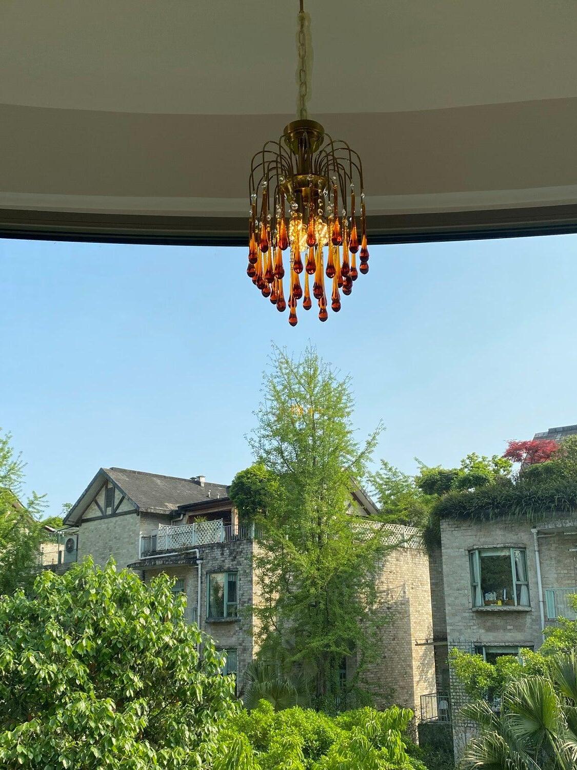 Small crystal chandelier shown near an open view