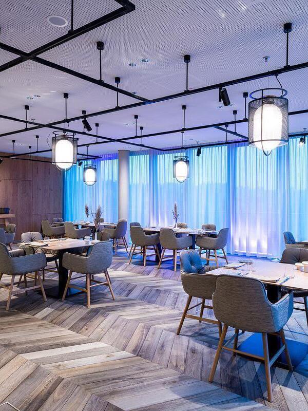 Several black hanging lanterns in restaurant interior