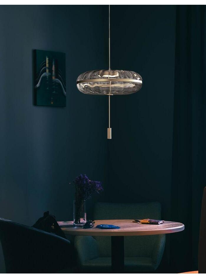 Illuminated Jolie pendant in a dark room