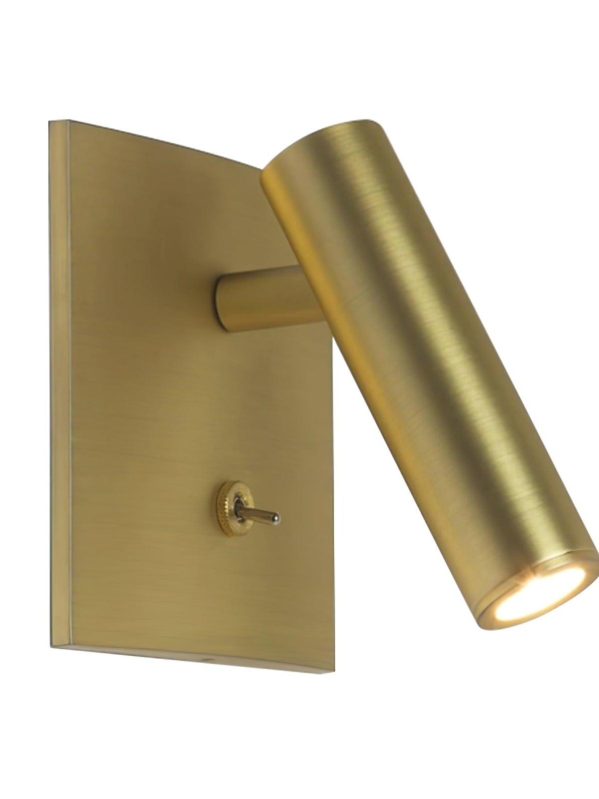 Enna gold-tone plated wall light with square plate, lower toggle and angled cylindrical head illuminated on white