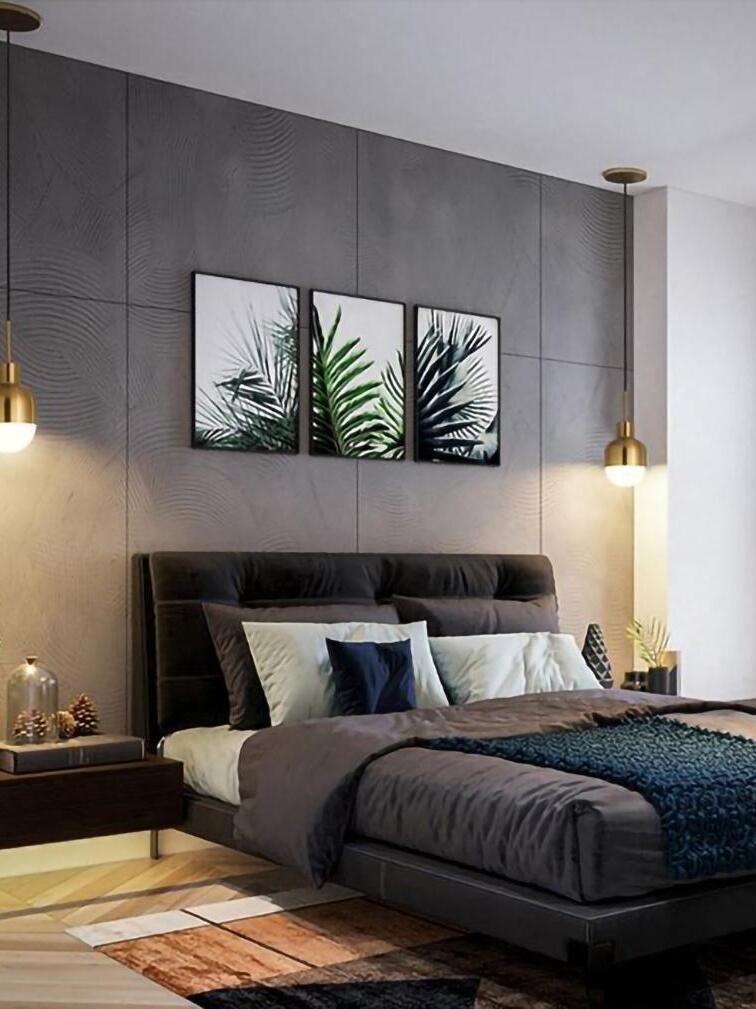 Two Niku pendants on separate canopies flanking a dark upholstered bed beneath leaf prints
