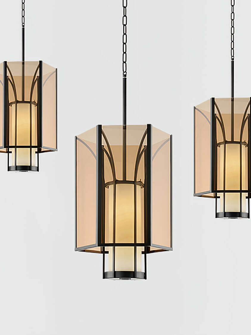 Three Remy lanterns suspended against light background