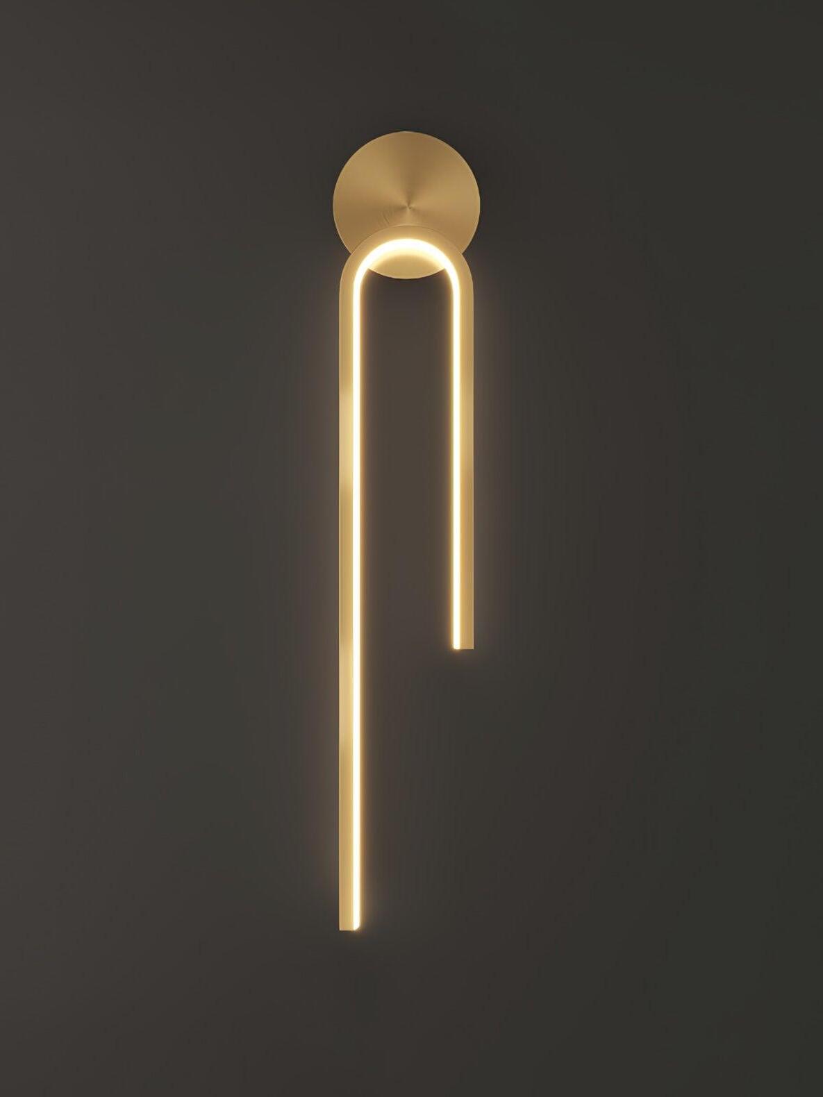 Glowing gold-tone arch with unequal arms and a round upper backplate on a dark gray background
