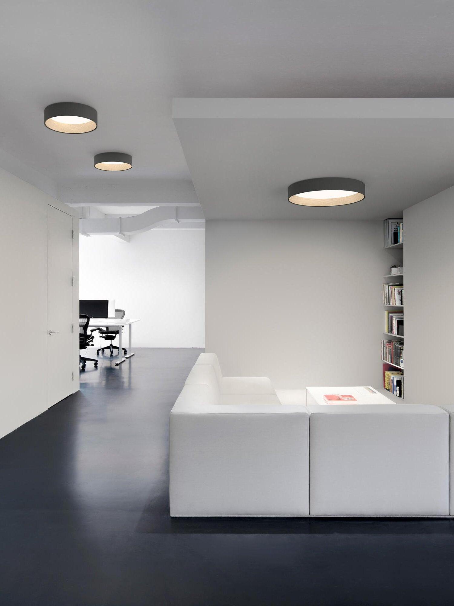 Three black round lights in living-room ceiling