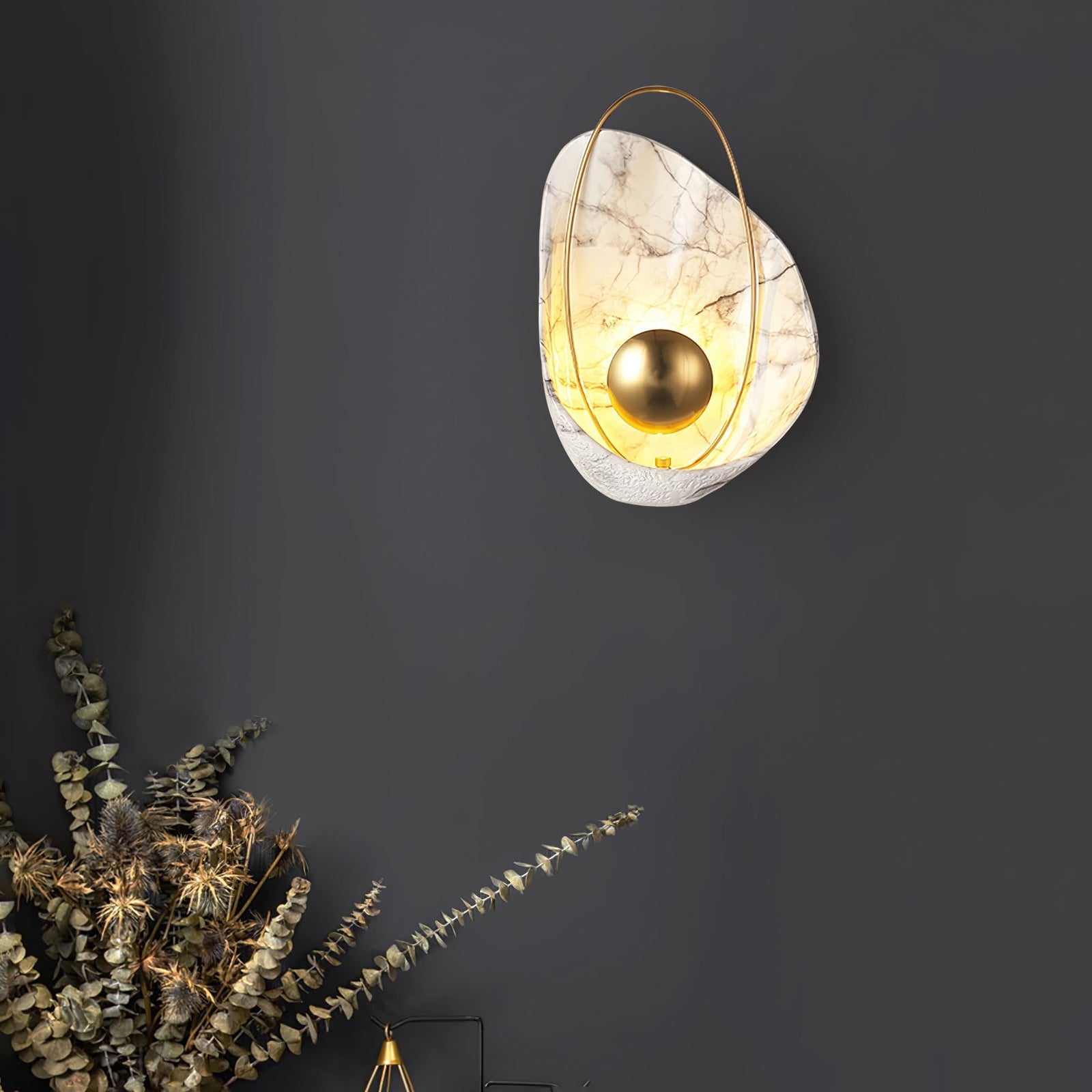 Illuminated veined wall light on a dark background