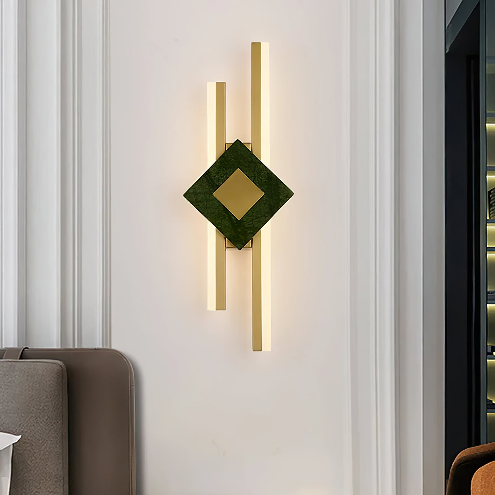Green marble wall light on a pale paneled wall