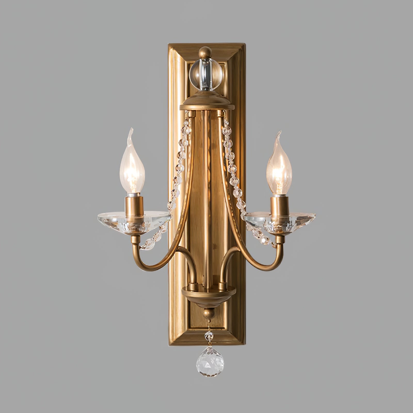 Front view of the Copper wall sconce and hanging crystal ball