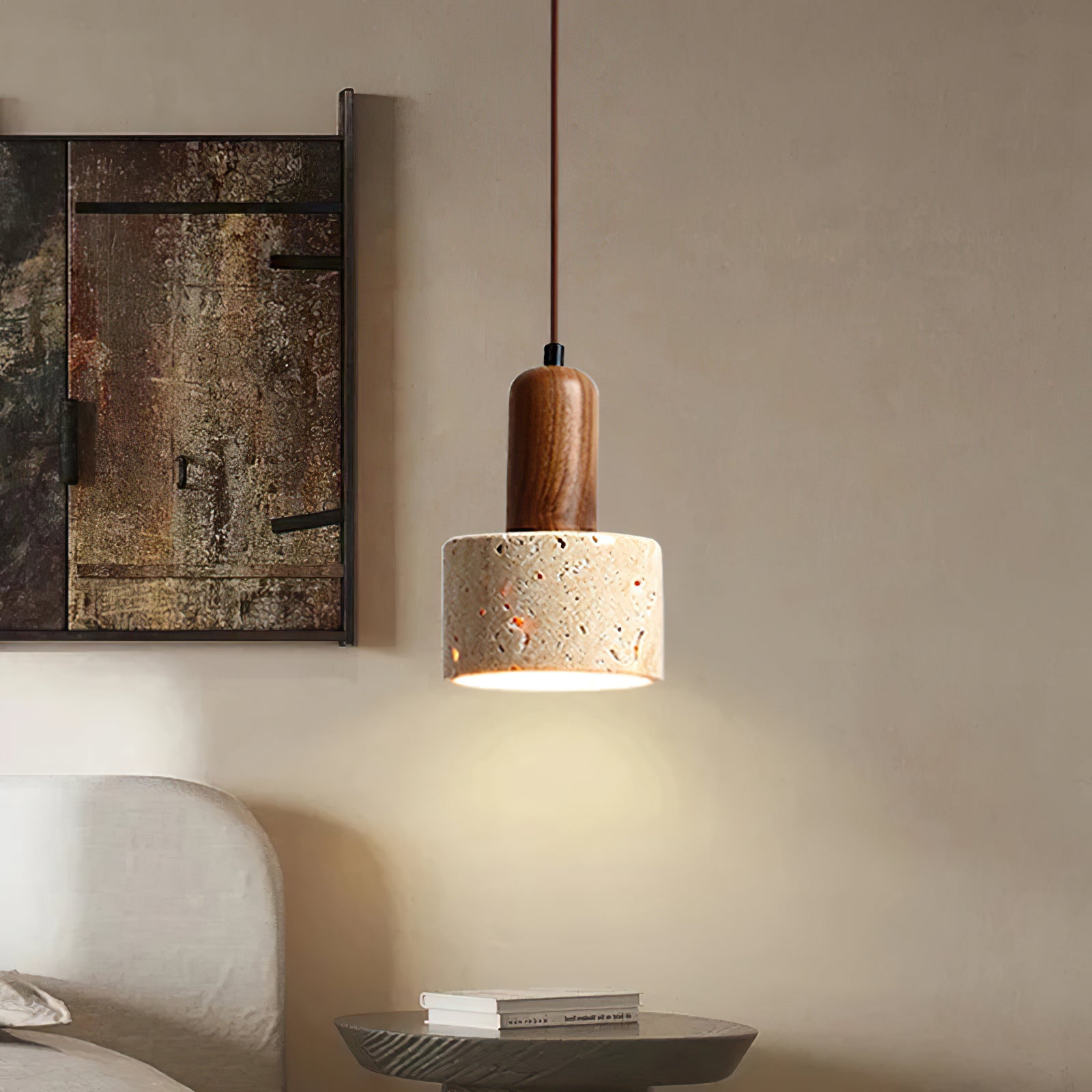 Travertine cylinder pendant near a sofa and side table