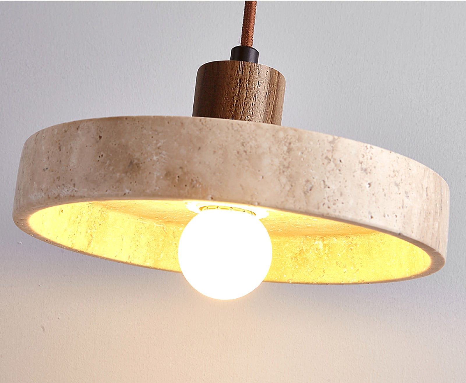 Angled view of the stone shade and spherical light below