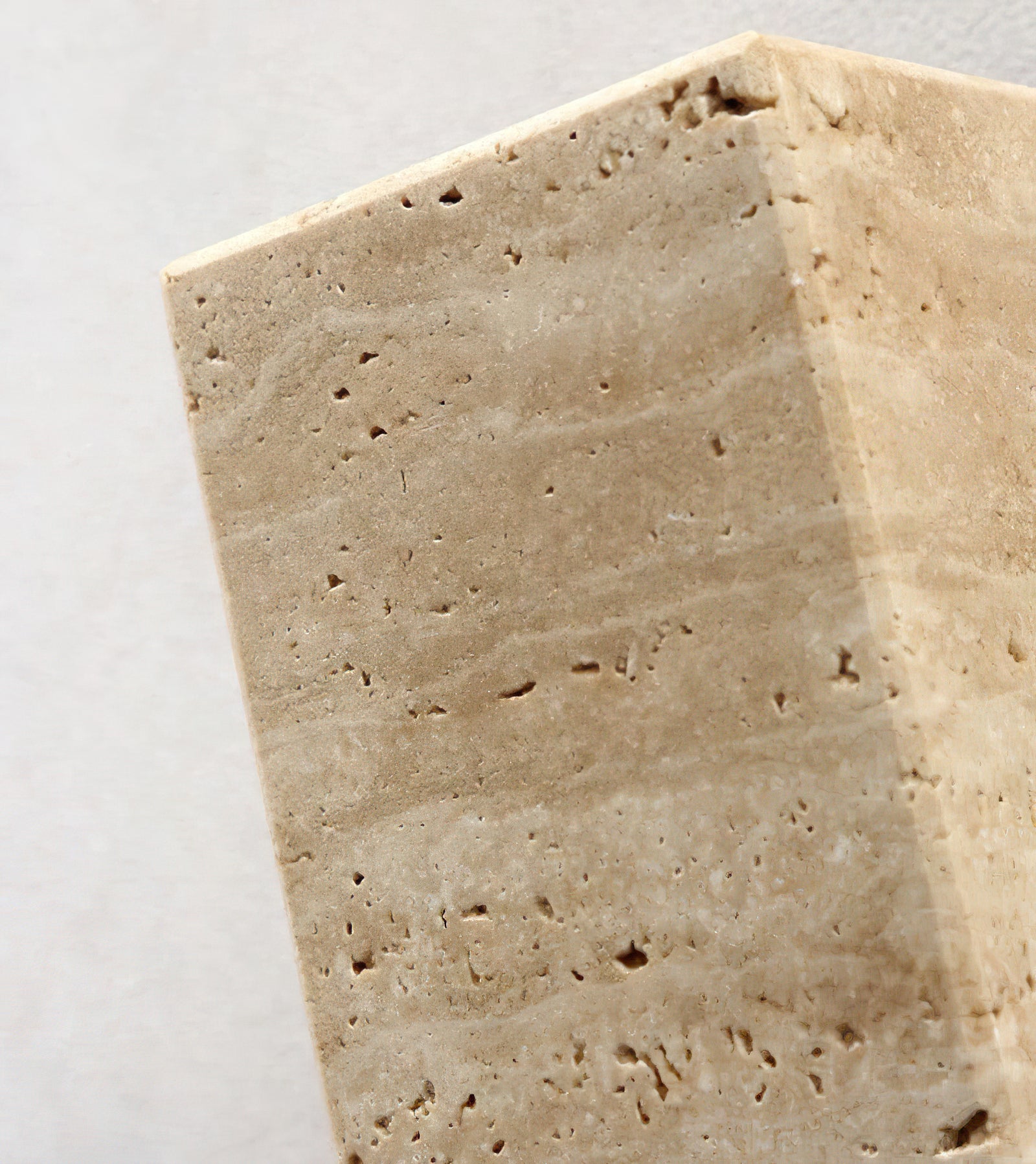 Close-up of natural pores and layered markings in the stone shade