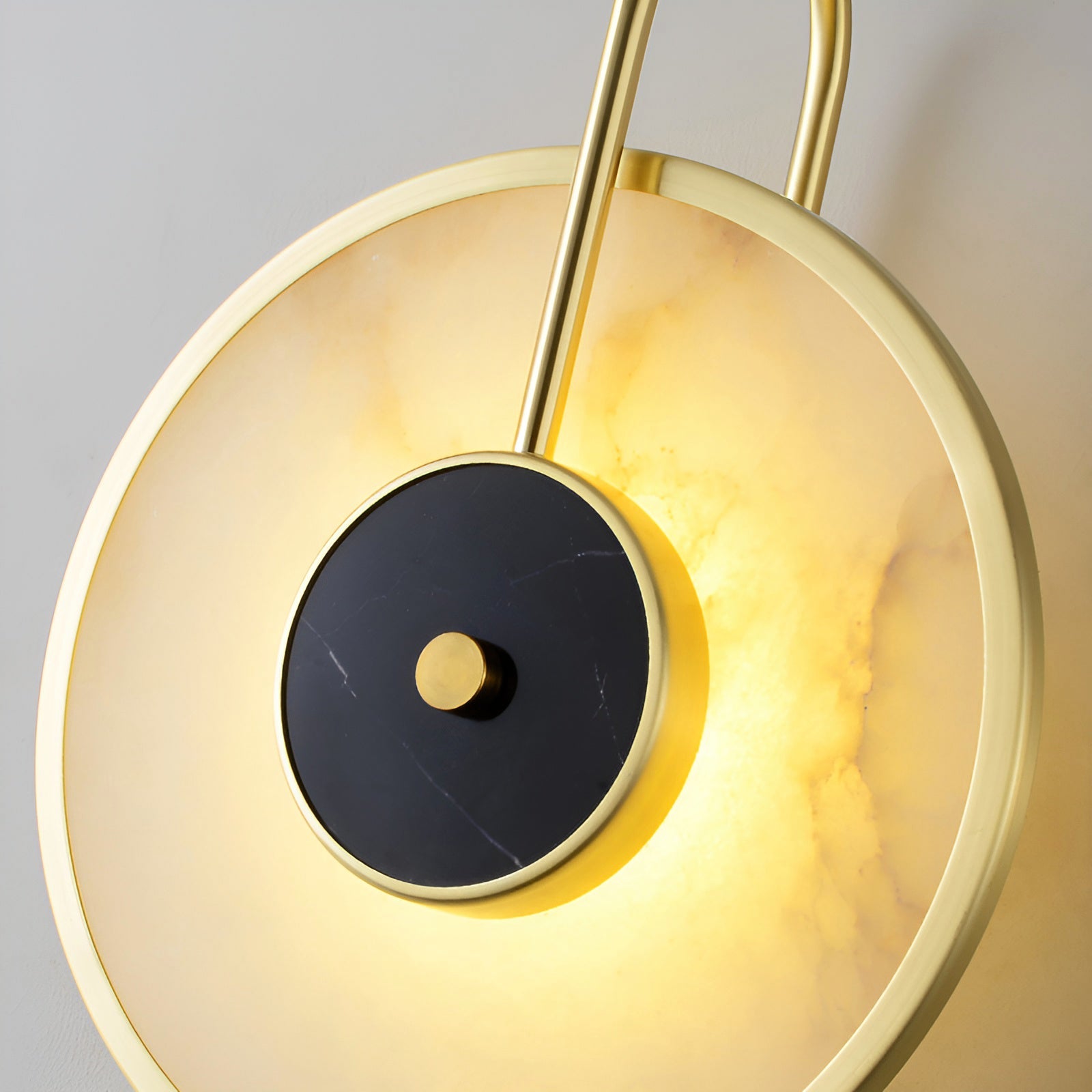 Detail of illuminated pale stone surrounding the black central disc