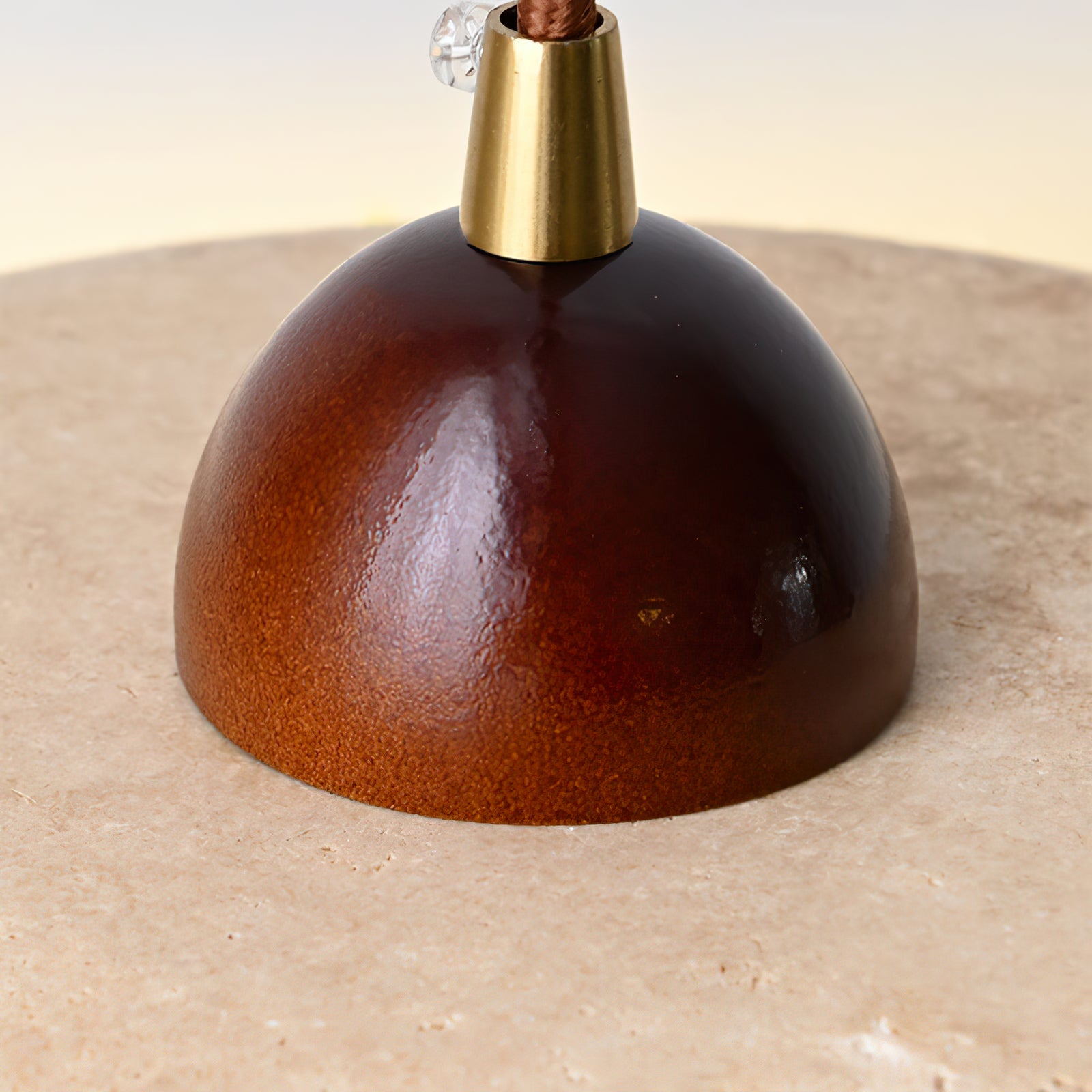 Close-up of the rounded brown top fitting and cable entry