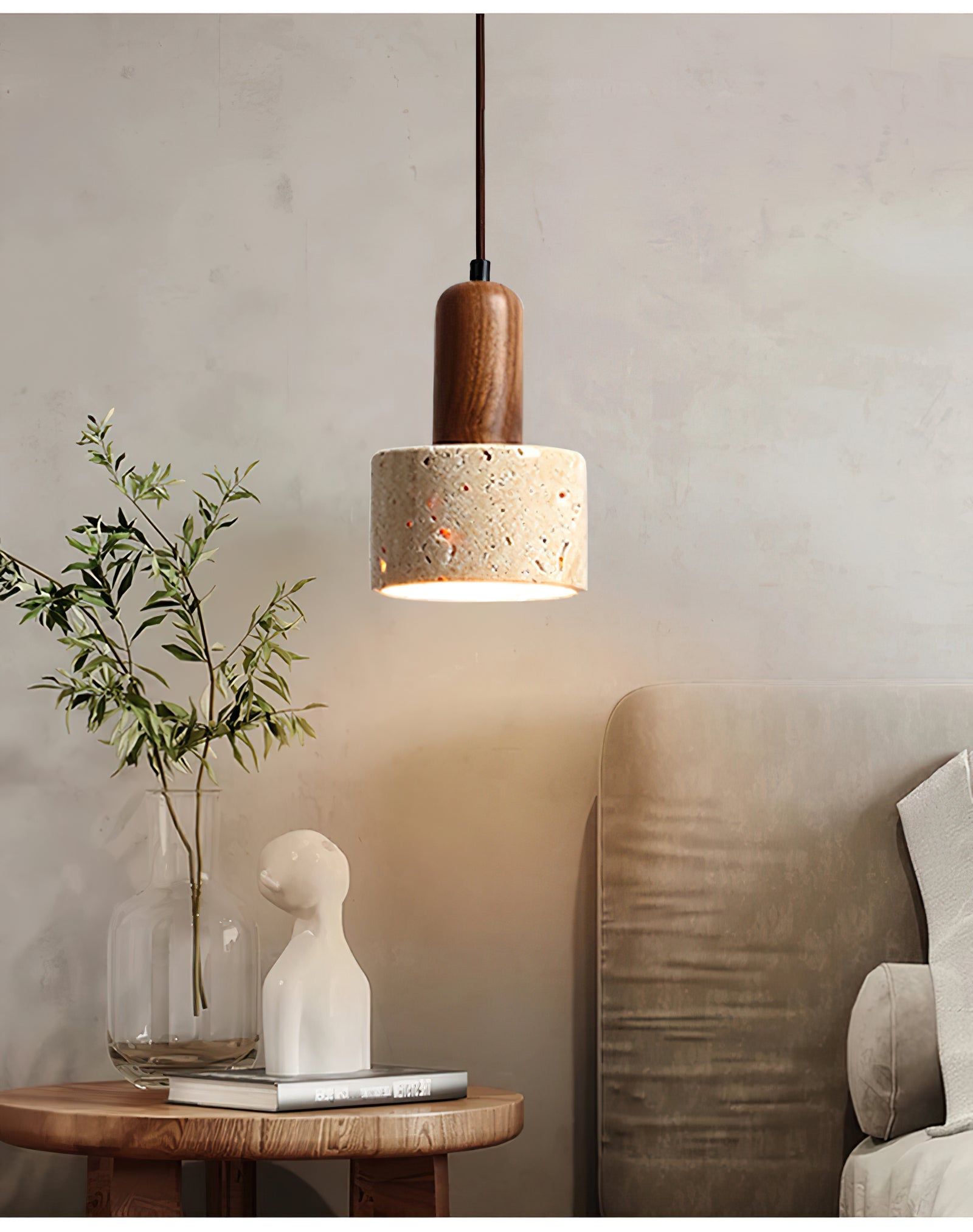 Small stone pendant above a cabinet beside a sofa
