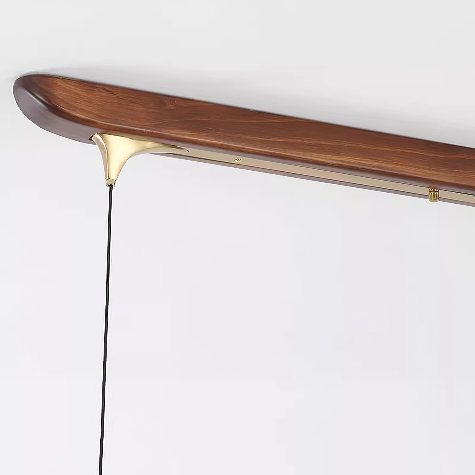 Angled detail of the wood-finish bar and suspension fitting