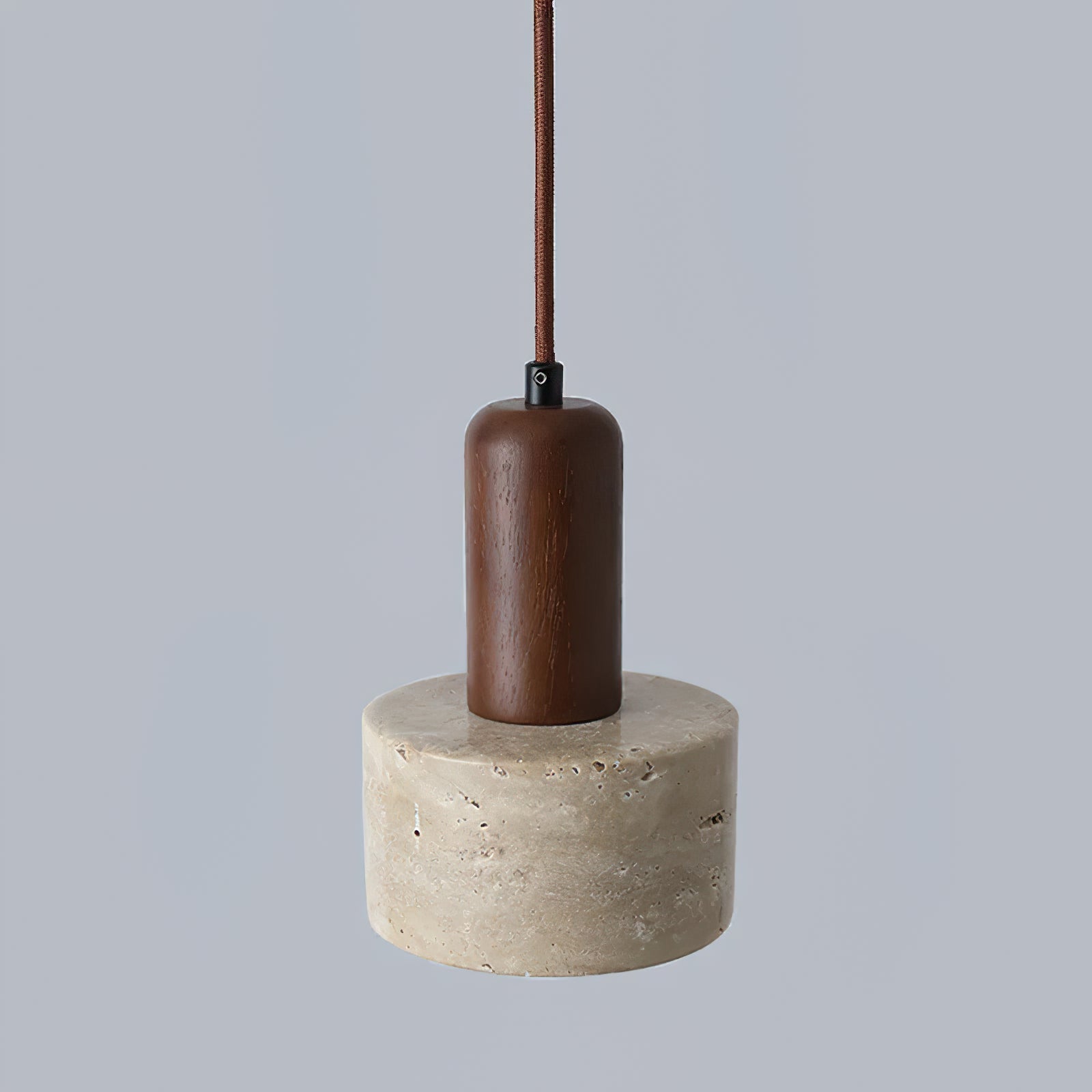 Unlit brown stem and pale porous stone cylinder