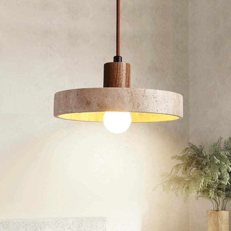 Dark wood-stem pendant with a round stone shade and glowing sphere