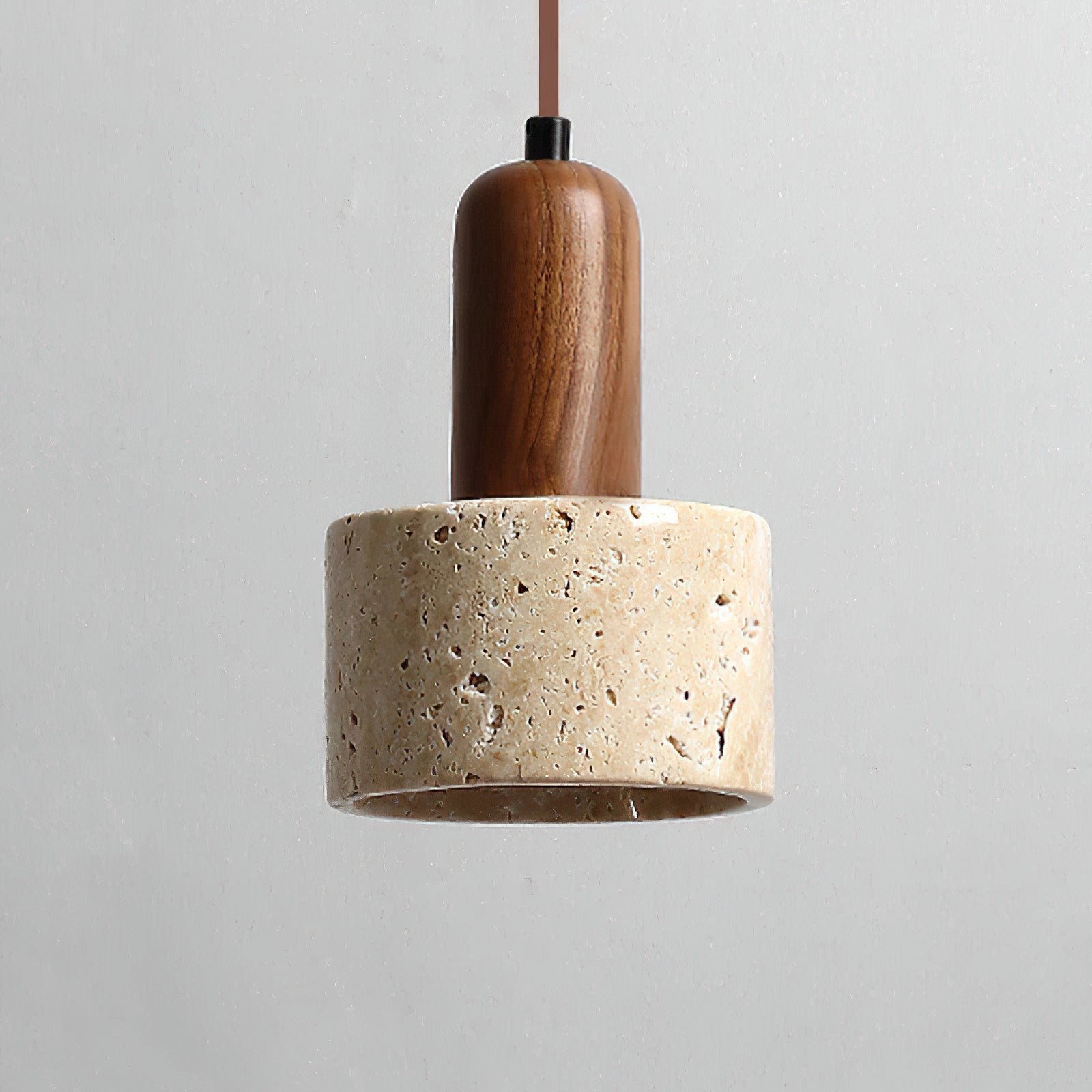 Front detail of rounded brown stem above the travertine shade