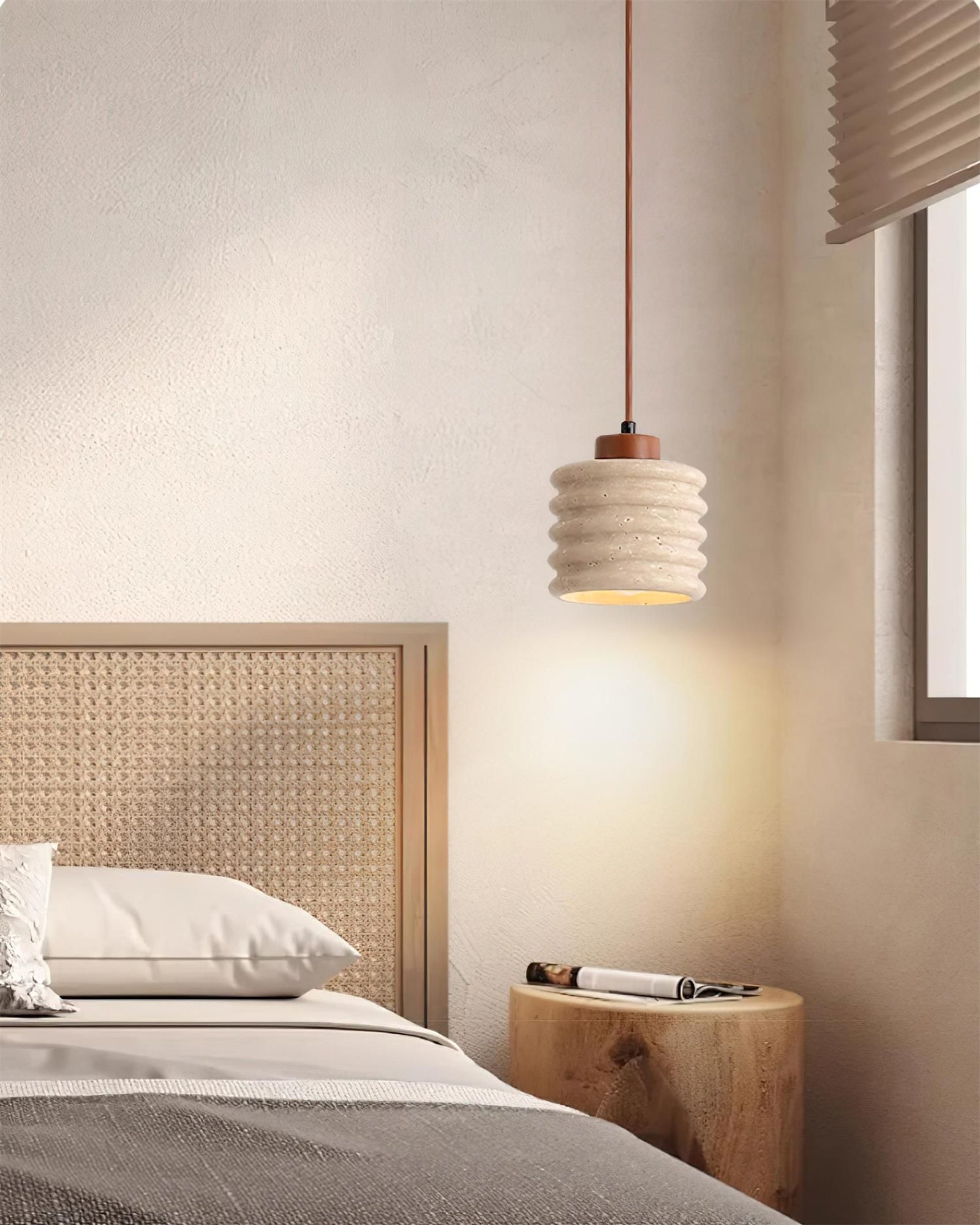 Ribbed stone pendant above a wooden bedside cabinet