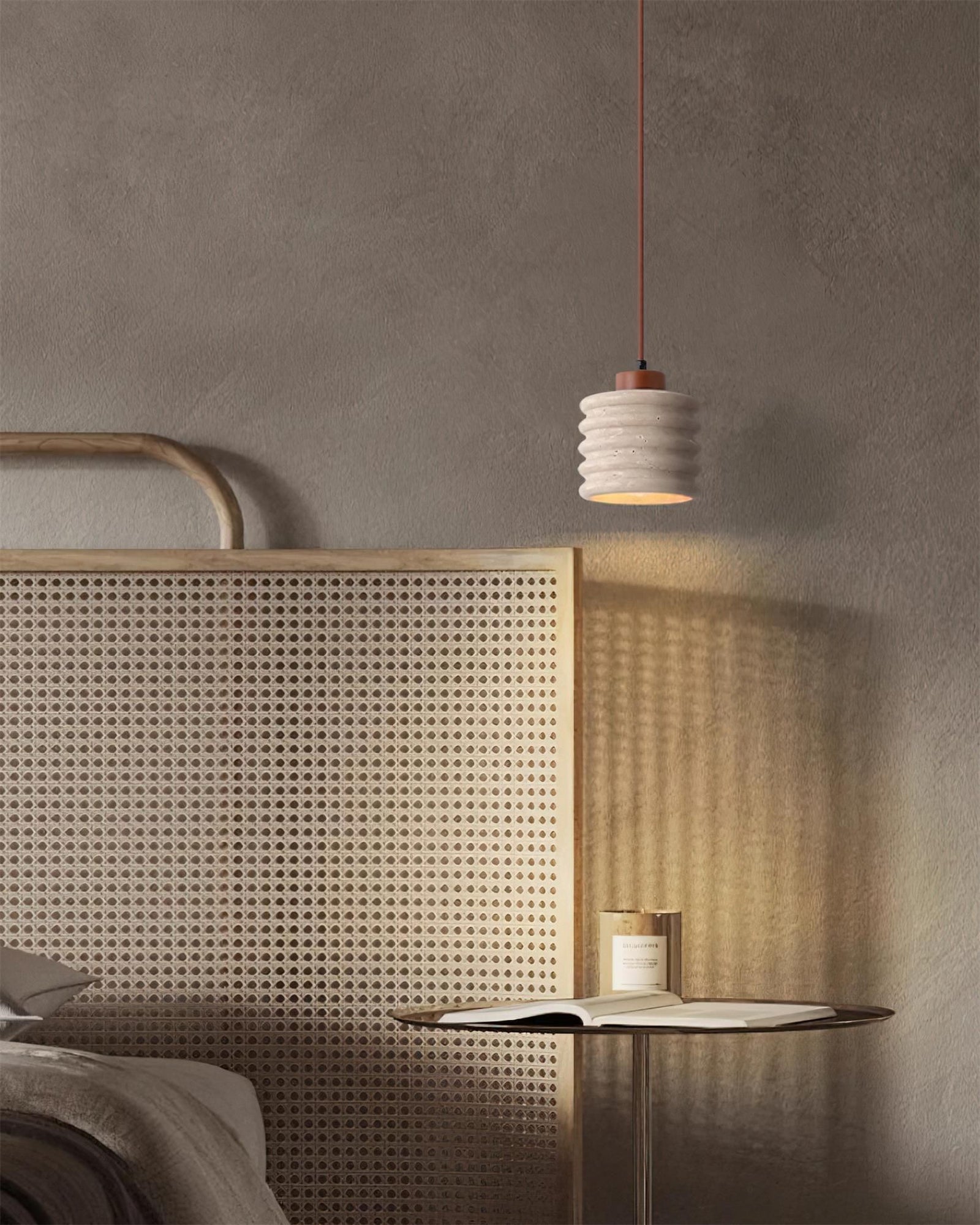 Ribbed pendant illuminating a woven bedroom screen