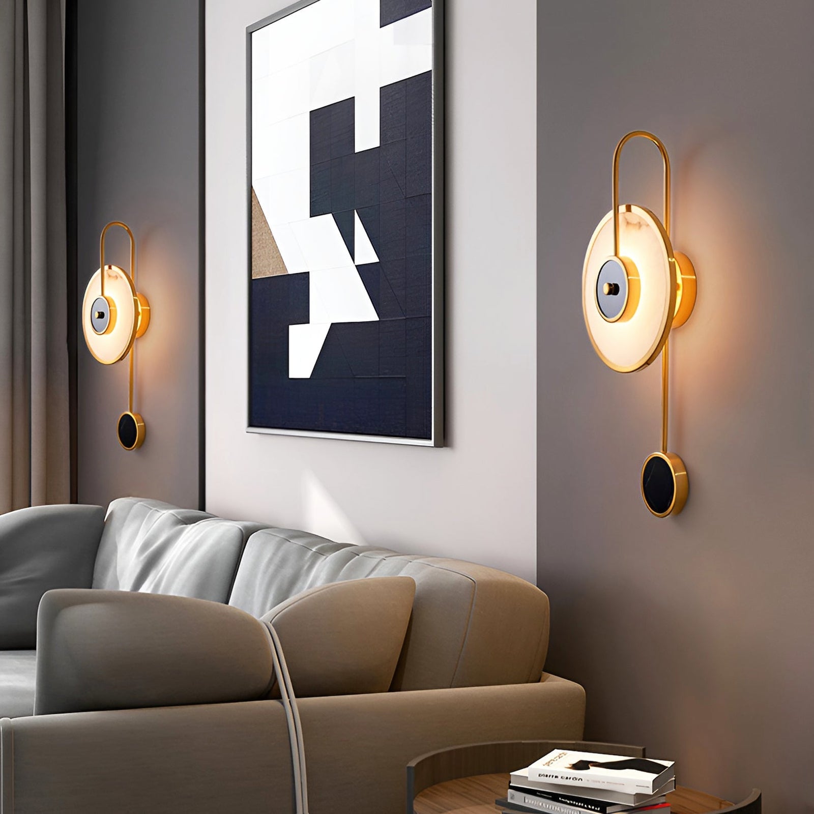 Two circular stone wall lights flanking wall art