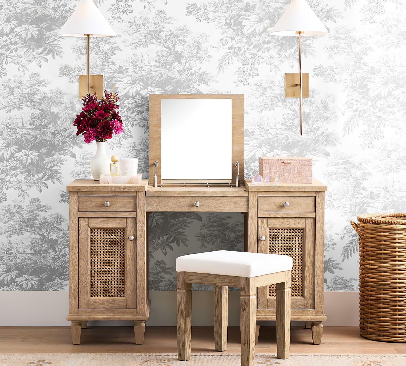 Two gold Ellis wall lights flanking a dressing-table mirror
