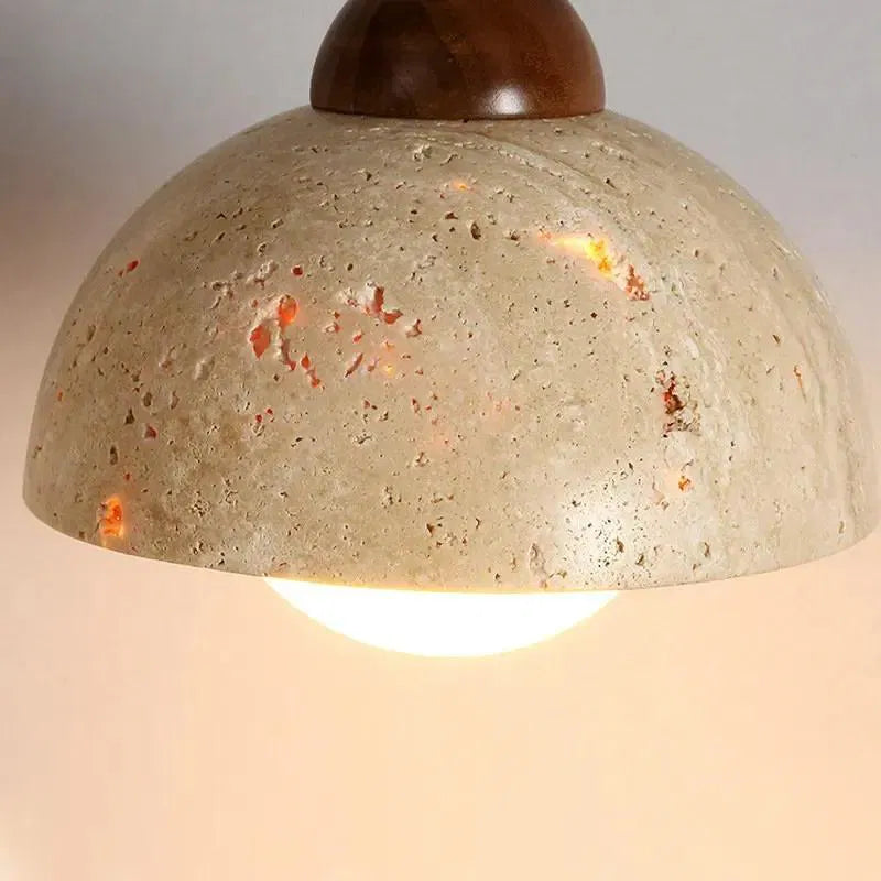 Illuminated travertine dome showing natural-looking surface pores
