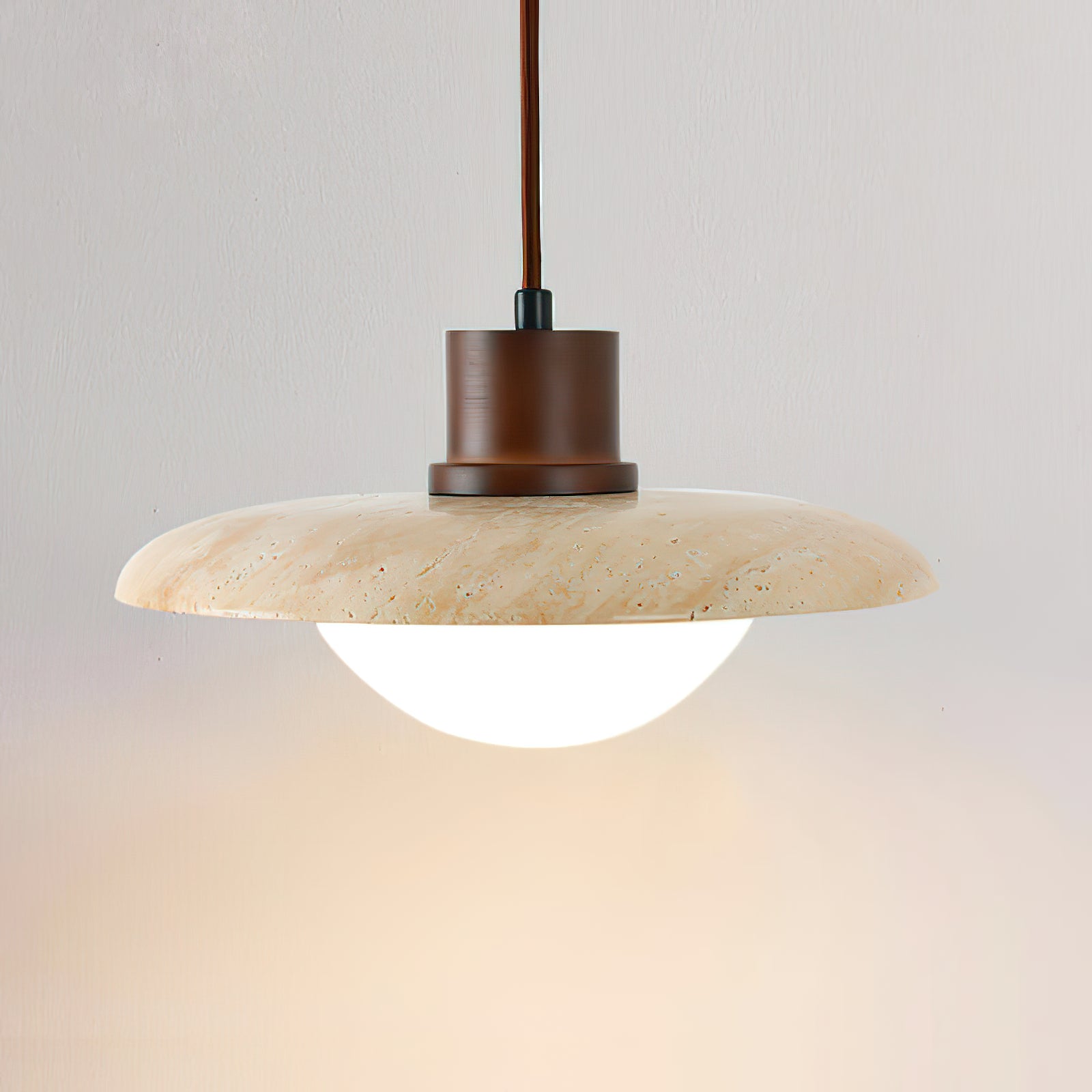 Detail of the pale travertine disc and white lower diffuser
