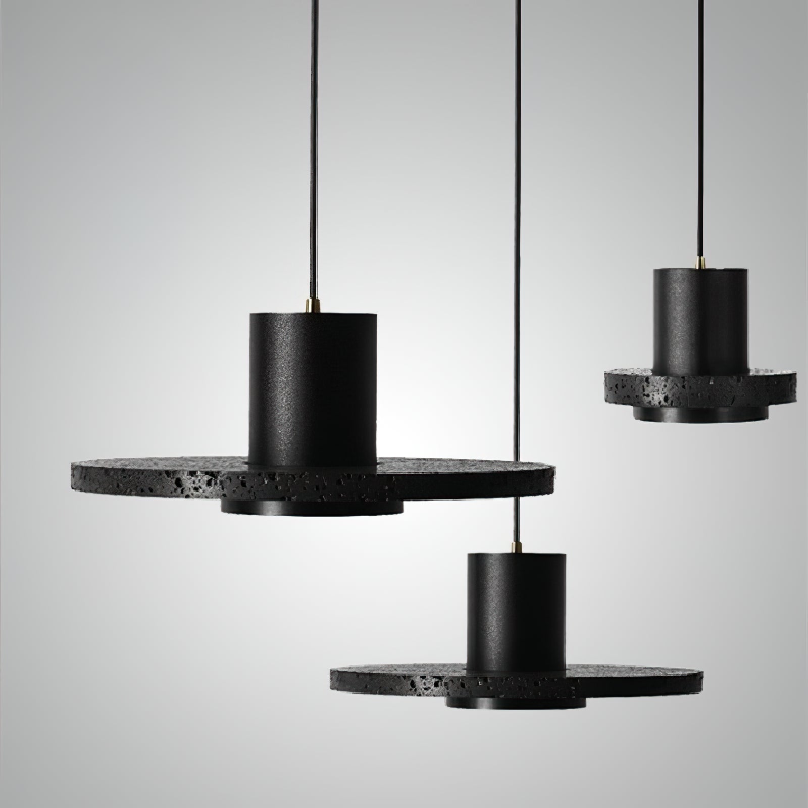 Black disc pendants showing different disc proportions