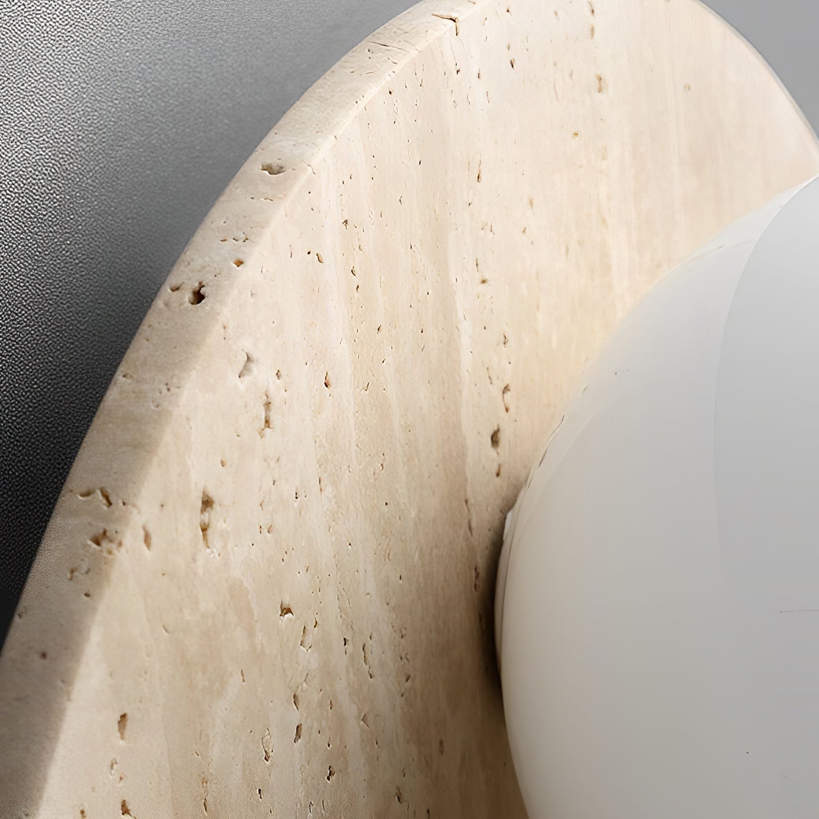 Side detail of the stone backplate and white glass globe