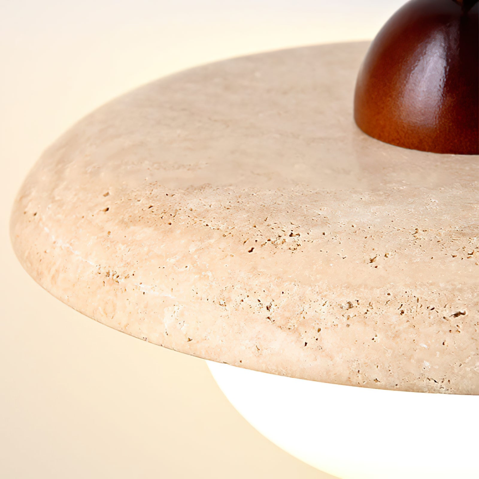 Detail of pores in the pale stone shade beside the brown top fitting