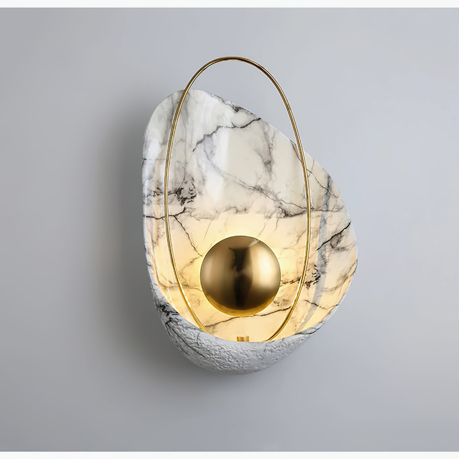 Glowing veined shell wall lamp against a pale wall