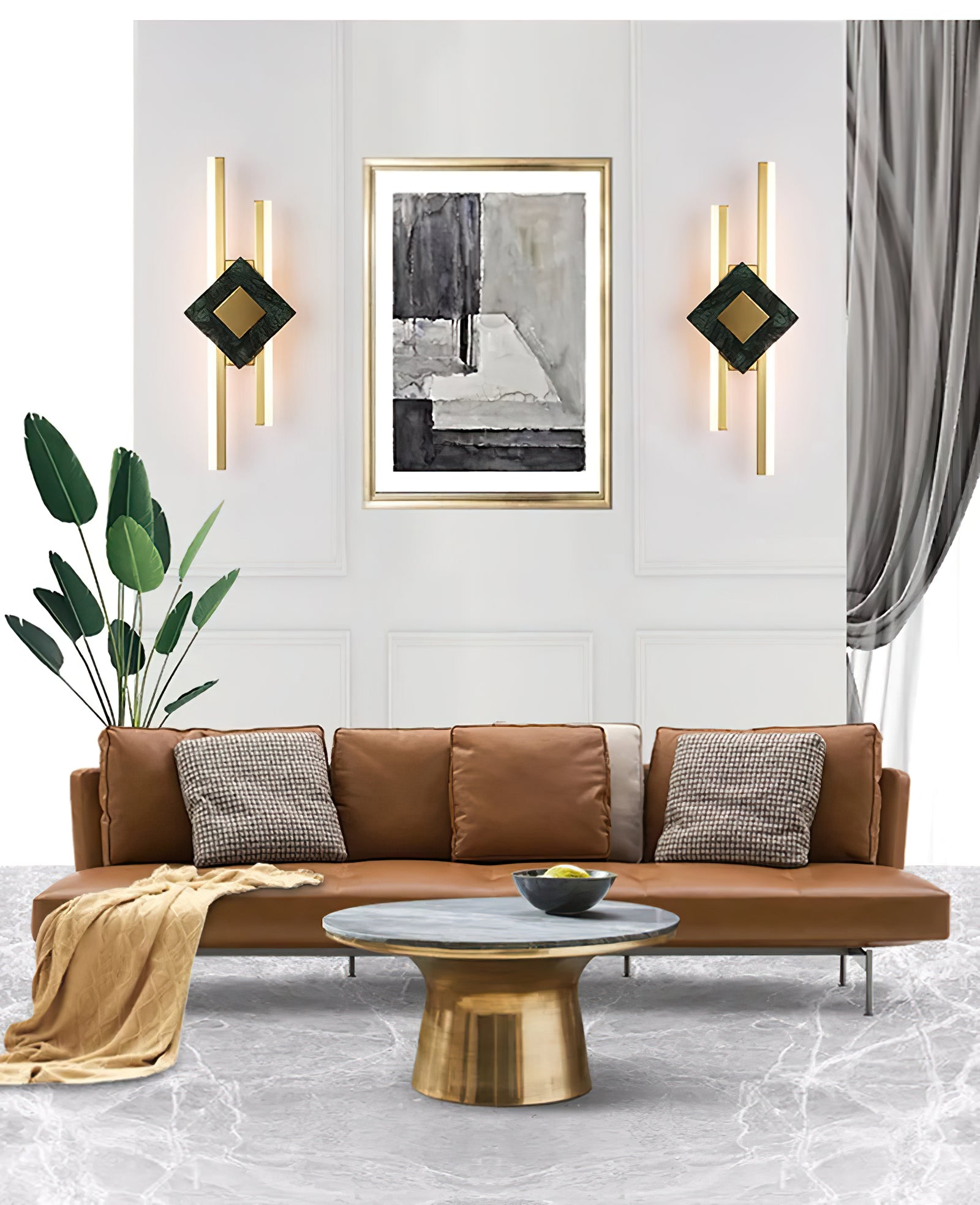 Pair of green marble sconces beside artwork above a tan sofa
