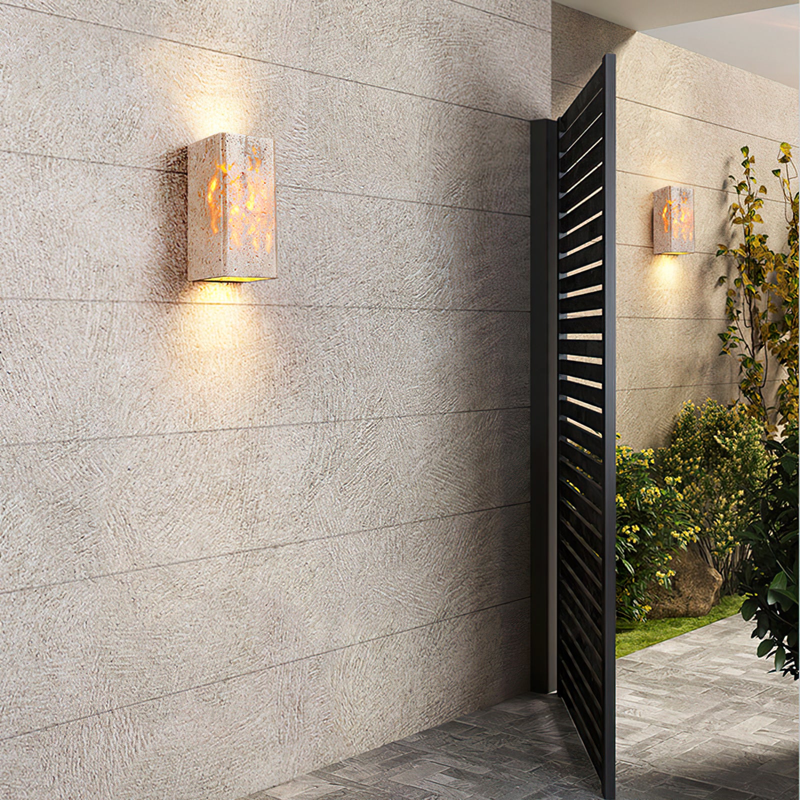 Two stone wall lights along a masonry entrance wall