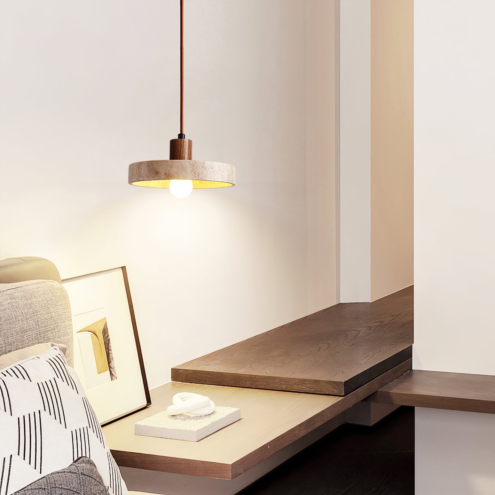 Small stone-and-wood pendant beside a bedroom shelf