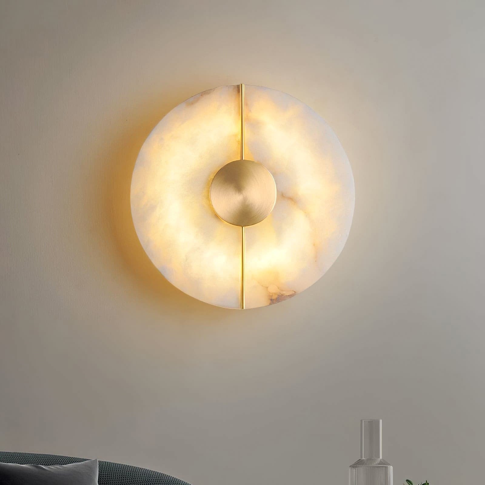 Illuminated marble wall light above a cabinet