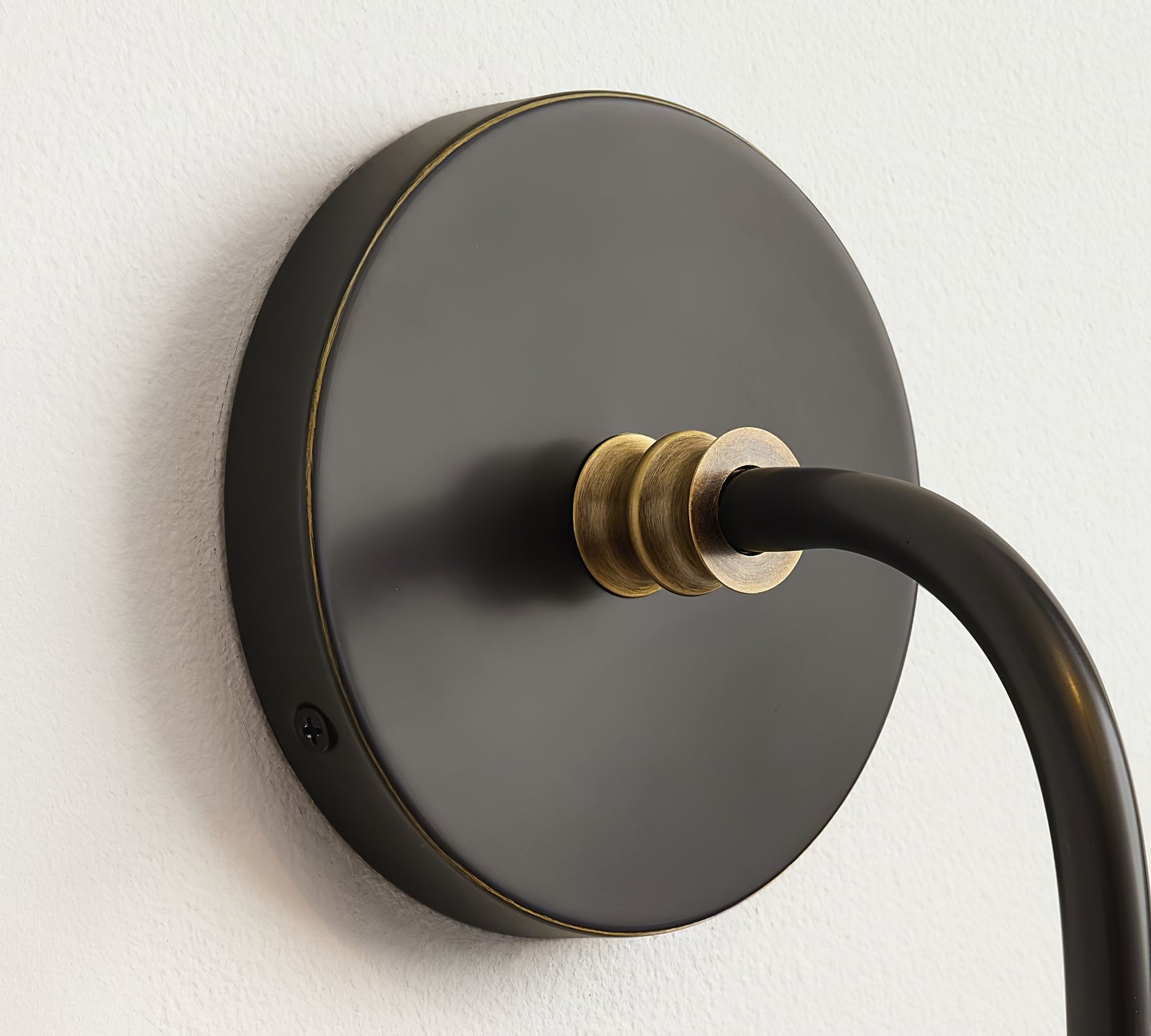 Round Collins backplate and curved arm connection detail