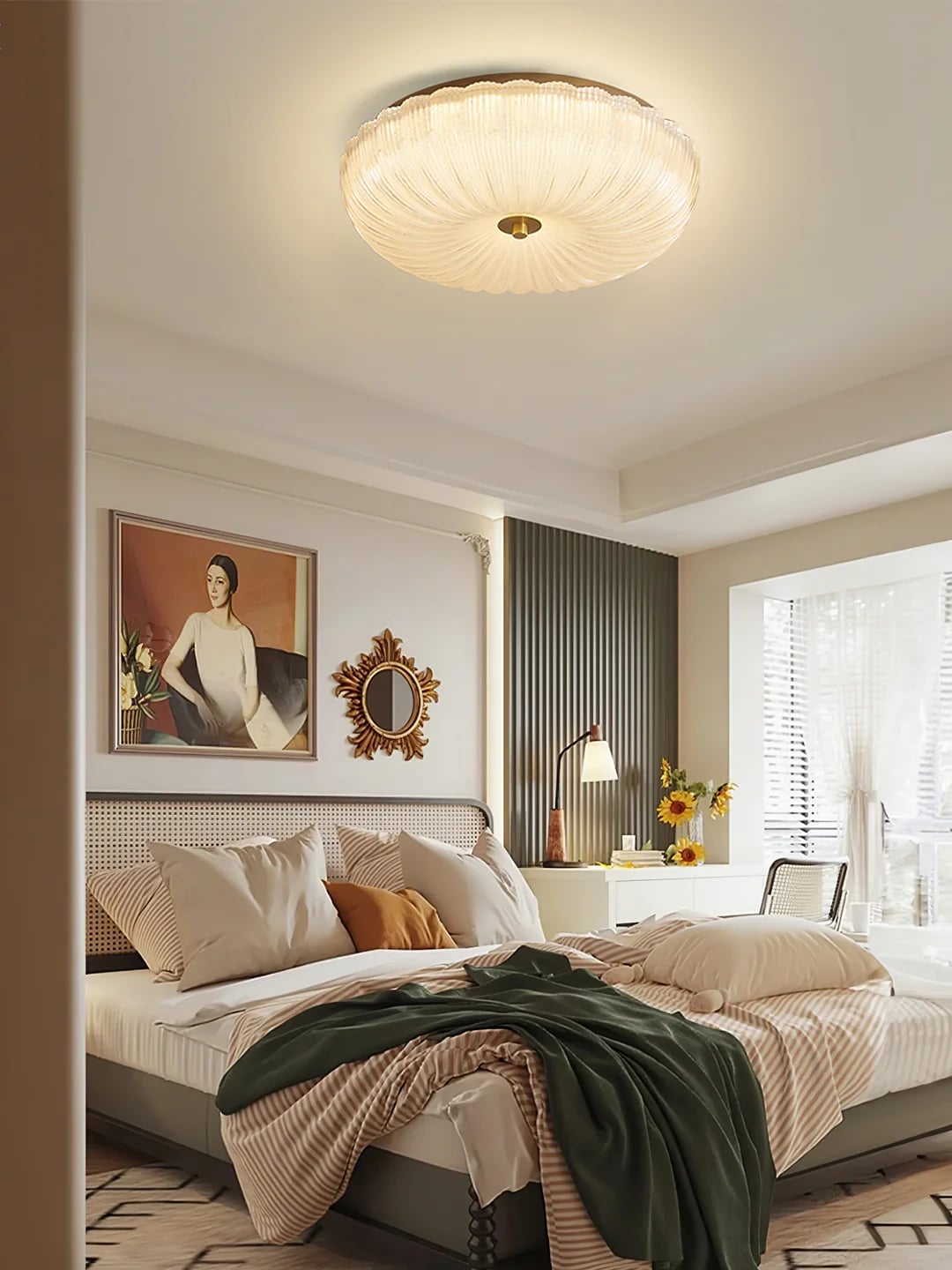 Ripple ceiling light in a bedroom with framed artwork
