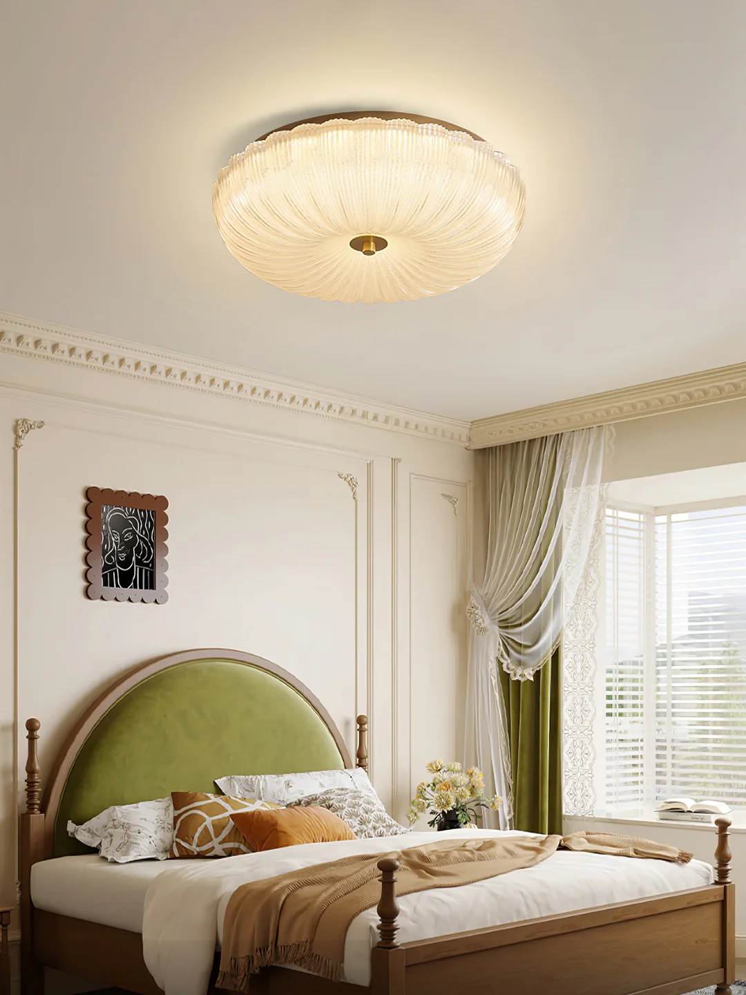 Warm-lit ceiling fixture in a pale bedroom