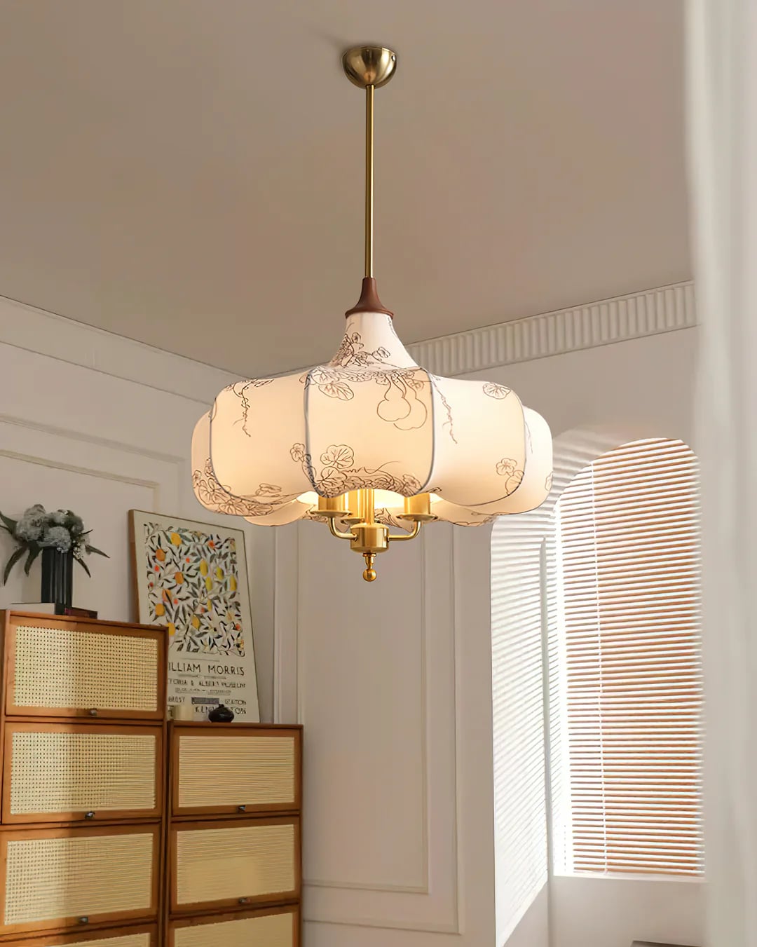 Closer room view of the patterned shade above a light cabinet
