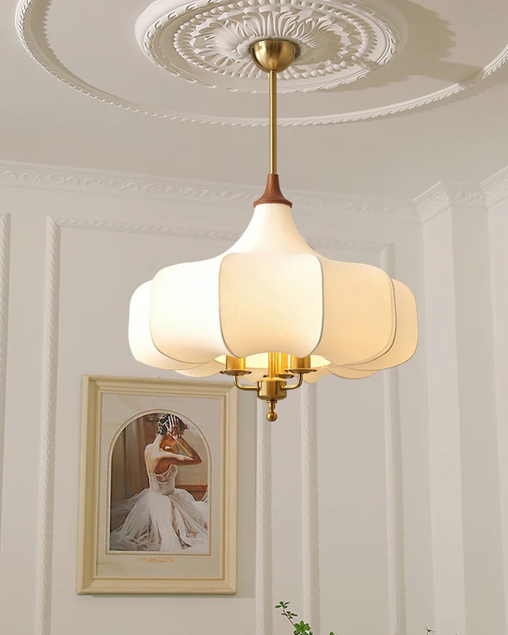 Plain Aurora Bloom pendant below a decorative ceiling beside framed wall art